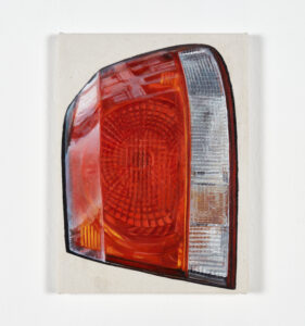 Photograph by Carlo Favore of a true-to-life painting of a red-and-white car light. By artist Helene Appel