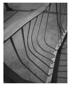 black and white photograph of a set of railings which has been bent, as though perhaps smashed into by a car. Photograph into LCR Photo Awards by Harry Flook.