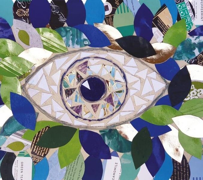 A collage with an eye in the centre of a background formed of leaves cut from paper in shades of green an blue. The iris of the eye is not one distinct colour but instead has shades of brown and blue.